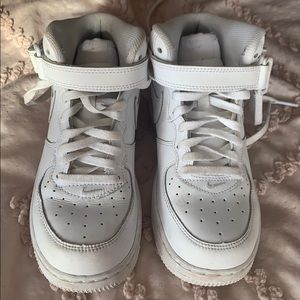Boys white leather Nike sneakers